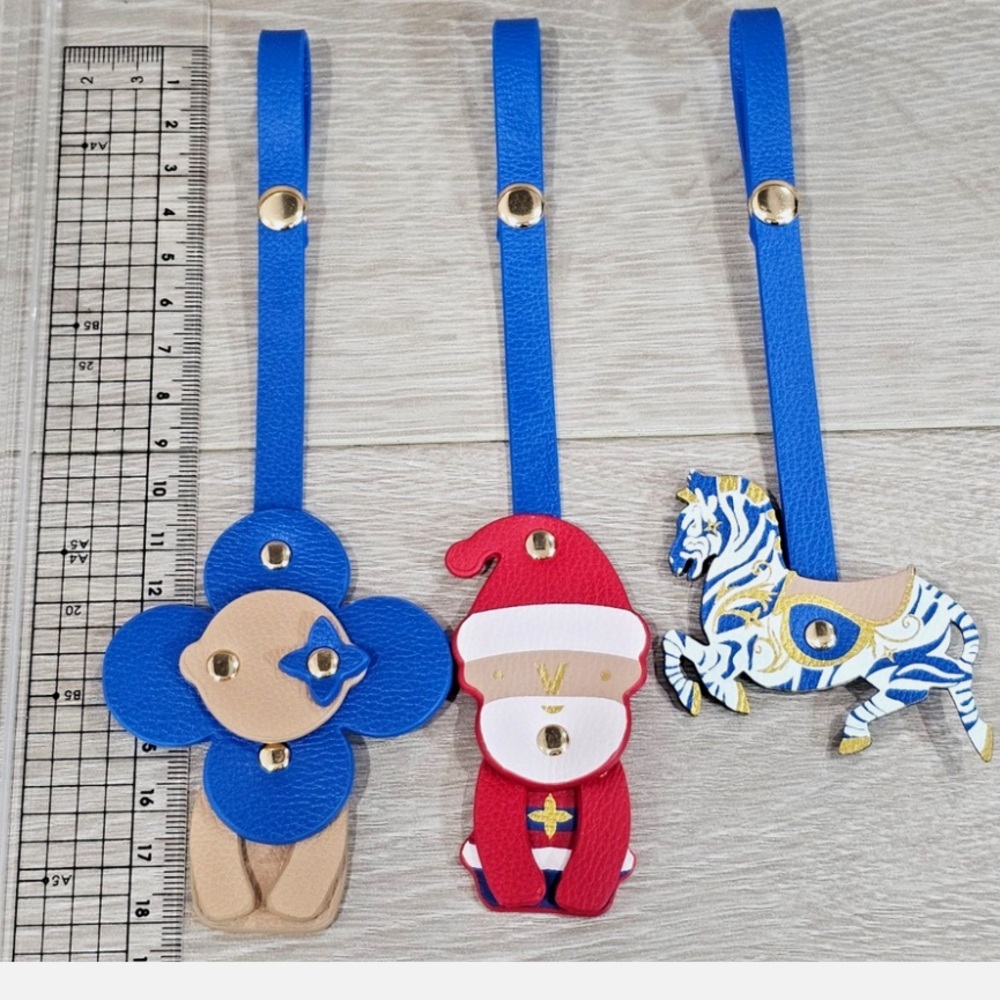 Authentic Louis Vuitton 2024 Carousel Vivienne Purse Charm Set
